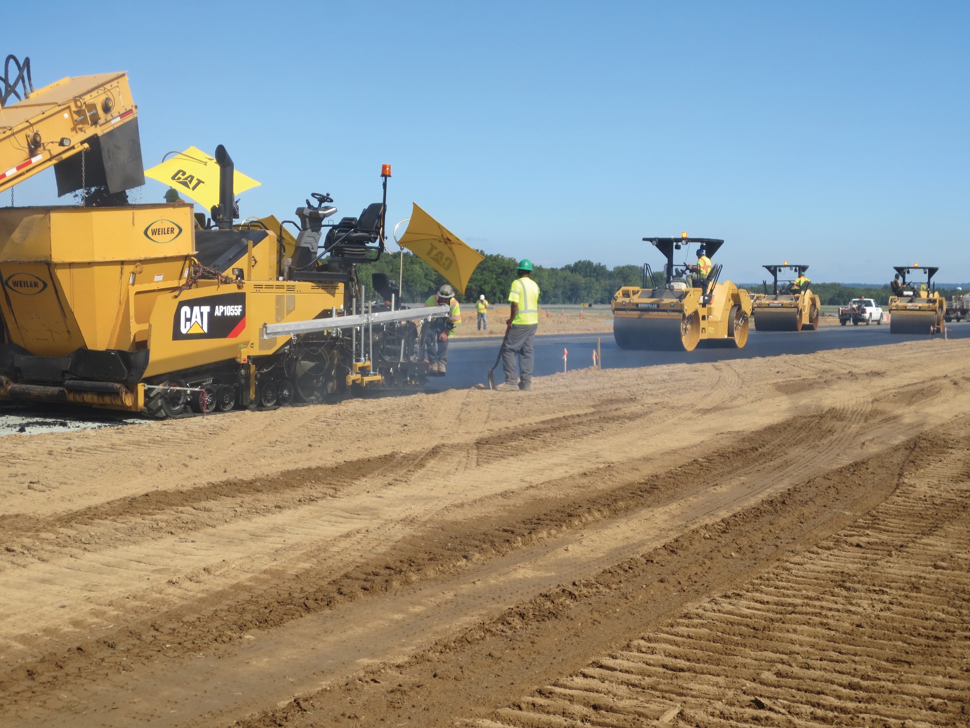 Road grader levelling the surface